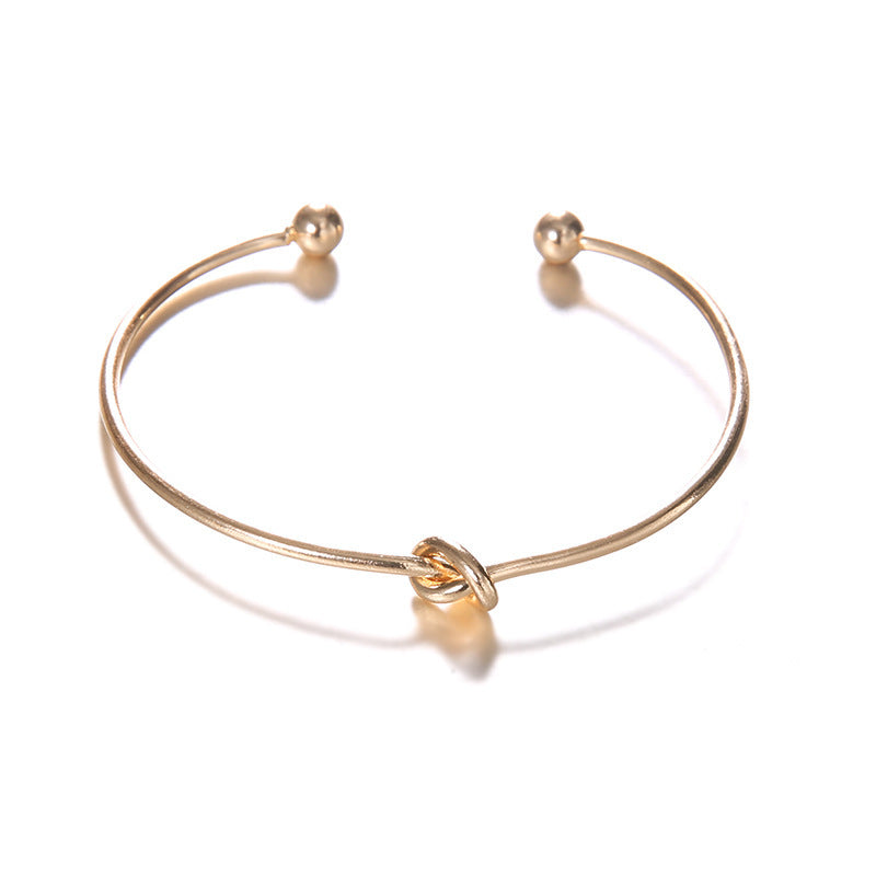 Freedom’s Direction – Arrow & Knot Gold Cuff